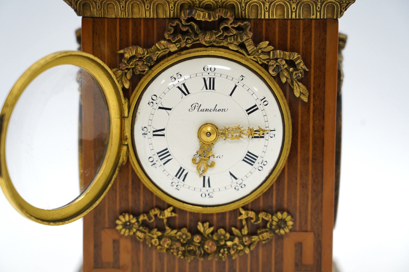 A 19th century French ormolu mounted, mahogany and box wood inlaid timepiece, by Planchon of Paris, with Wedgwood style plaques inlaid to sides, key included, 23cm. Condition - fair to good, not tested as working